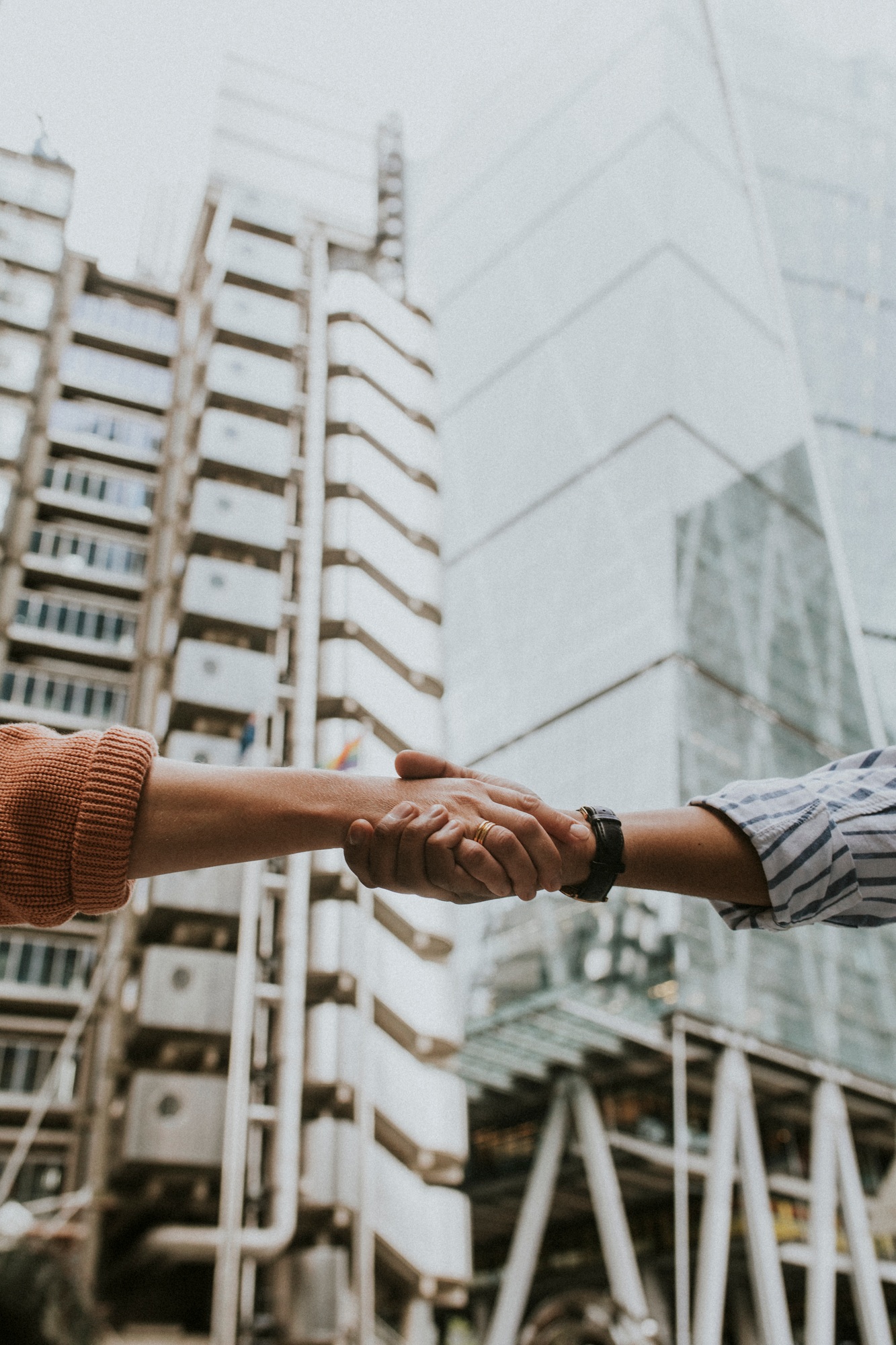 People holding hands, business handshake