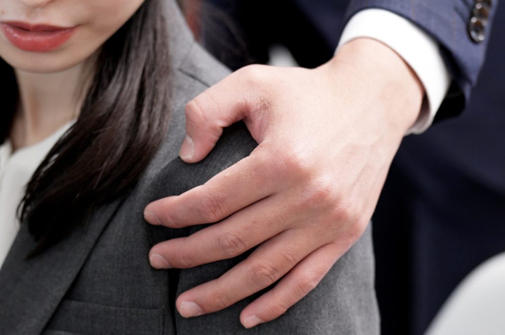 Asian businesswoman being sexually harassed